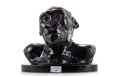 Lot 49 - BLACK PAINTED PLASTER BUST OF AN INFANT GORILLA