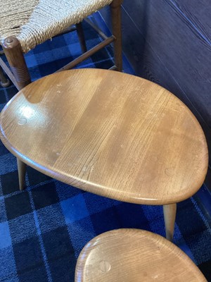 Lot 506 - ERCOL, NEST OF THREE MODEL 354 'PEBBLE' ELM TABLES