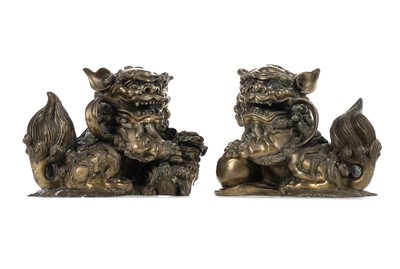 Lot 1097 - OPPOSING PAIR OF CHINESE POLISHED BRONZE FO DOGS