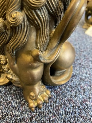 Lot 1097 - OPPOSING PAIR OF CHINESE POLISHED BRONZE FO DOGS