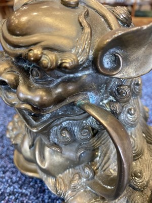 Lot 1097 - OPPOSING PAIR OF CHINESE POLISHED BRONZE FO DOGS