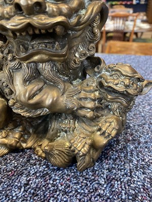 Lot 1097 - OPPOSING PAIR OF CHINESE POLISHED BRONZE FO DOGS