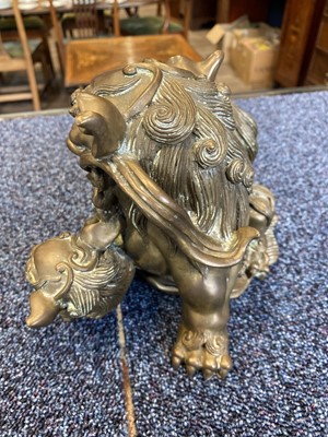 Lot 1097 - OPPOSING PAIR OF CHINESE POLISHED BRONZE FO DOGS