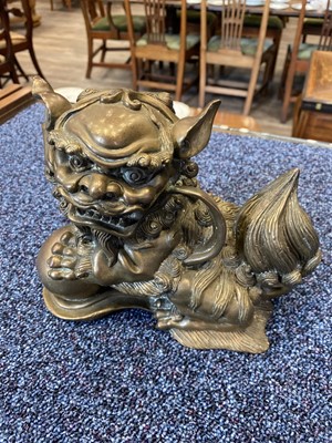 Lot 1097 - OPPOSING PAIR OF CHINESE POLISHED BRONZE FO DOGS