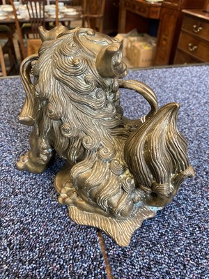 Lot 1097 - OPPOSING PAIR OF CHINESE POLISHED BRONZE FO DOGS