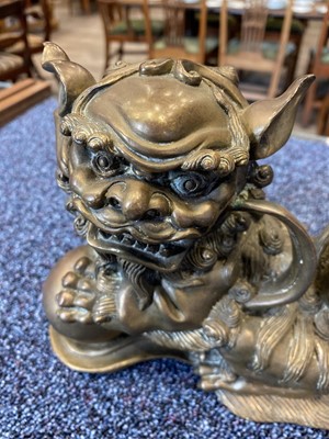 Lot 1097 - OPPOSING PAIR OF CHINESE POLISHED BRONZE FO DOGS