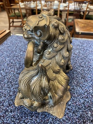 Lot 1097 - OPPOSING PAIR OF CHINESE POLISHED BRONZE FO DOGS