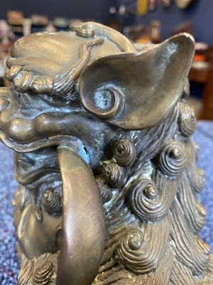 Lot 1097 - OPPOSING PAIR OF CHINESE POLISHED BRONZE FO DOGS
