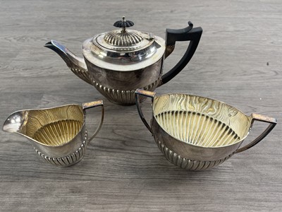 Lot 493 - SILVER PLATED THREE PIECE TEA SERVICE