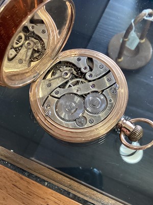 Lot 803 - NINE CARAT GOLD POCKET WATCH ON STAND