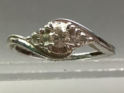 Lot 237 - NINE CARAT WHITE GOLD AND DIAMOND THREE STONE RING