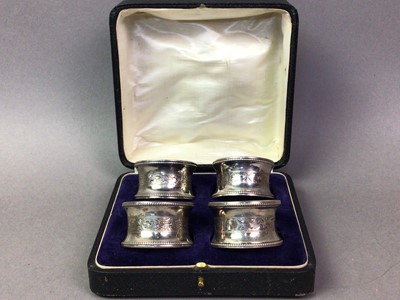 Lot 77 - SET OF FOUR ELIZABETH II SILVER NAPKIN RINGS