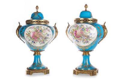 Lot 721 - PAIR OF RUSSIAN PORCELAIN LIDDED URNS IN THE MANNER OF SEVRES