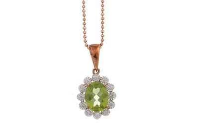 Lot 457 - PERIDOT AND DIAMOND PENDANT