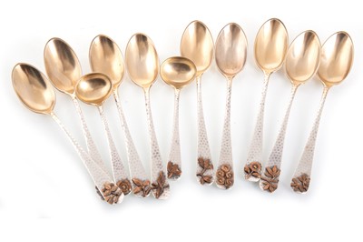Lot 194 - NINE AMERICAN STERLING SILVER AND PARCEL GILT TEASPOONS
