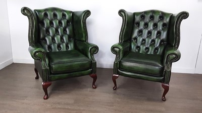 Lot 62 - PAIR OF GREEN LEATHER WINGBACK CHAIRS