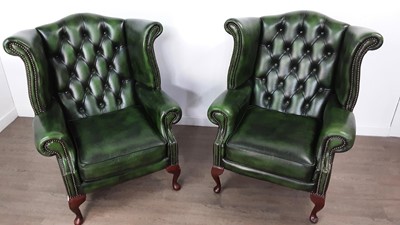 Lot 62 - PAIR OF GREEN LEATHER WINGBACK CHAIRS