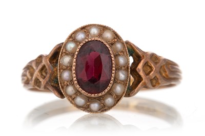 Lot 786 - GARNET AND SEED PEARL RING