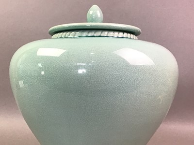 Lot 551 - TWO CELADON GLAZED BALUSTER JARS AND COVERS