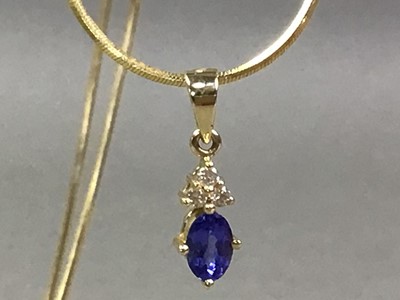 Lot 574 - TANZANITE AND DIAMOND PENDANT