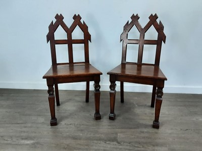 Lot 557 - PAIR OF VICTORIAN OAK GOTHIC HALL CHAIRS