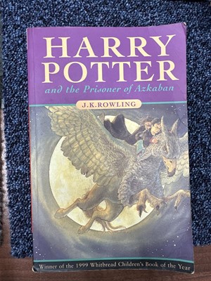 Lot 921 - ROWLING (J .K.), THREE HARRY POTTER VOLUMES, SIGNED WITH PERSONALISED INSCRIPTIONS