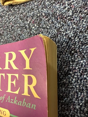 Lot 921 - ROWLING (J .K.), THREE HARRY POTTER VOLUMES, SIGNED WITH PERSONALISED INSCRIPTIONS