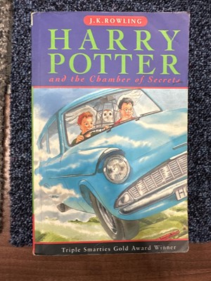 Lot 921 - ROWLING (J .K.), THREE HARRY POTTER VOLUMES, SIGNED WITH PERSONALISED INSCRIPTIONS