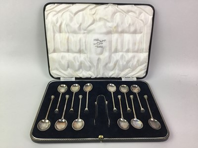 Lot 70 - SET OF TWELVE SILVER SEAL TOP COFFEE SPOONS WITH TONGS