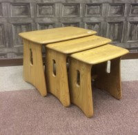Lot 857 - NEST OF THREE ERCOL LIGHT OAK TABLES with...