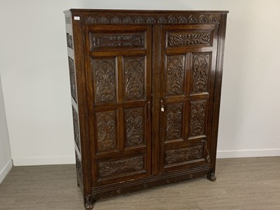 Lot 704 - CARVED OAK ARMOIRE