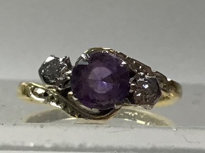 Lot 445 - AMETHYST AND DIAMOND THREE STONE CROSSOVER RING