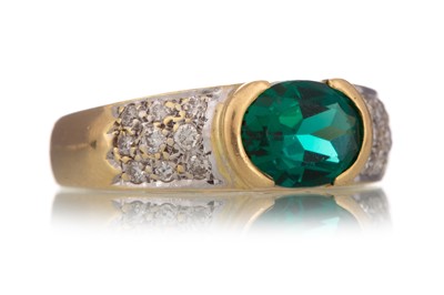 Lot 1197 - GREEN GEM SET AND DIAMOND RING