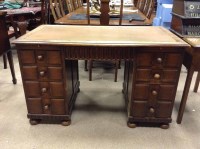 Lot 1017 - EARLY 20TH CENTURY OAK WRITING DESK with tan...