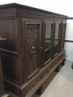 Lot 1024 - CARVED OAK BOOKCASE with stepped cornice, the...