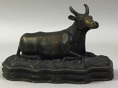 Lot 357 - CHINESE BRONZED METAL FIGURE OF A RECUMBENT BULL