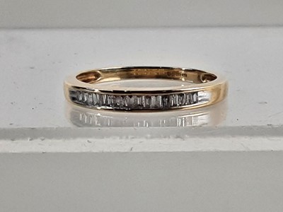 Lot 384 - NINE CARAT GOLD DIAMOND ETERNITY RING