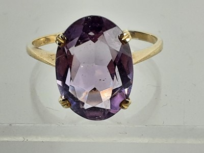 Lot 385 - NINE CARAT GOLD AMETHYST RING