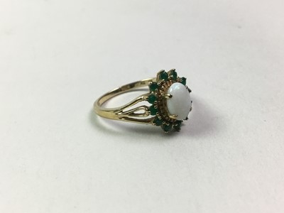 Lot 689 - OPAL AND EMERALD RING