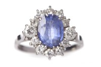 Lot 1 - TANZANITE AND DIAMOND CLUSTER RING the central...