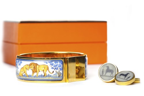 Lot 14 - HERMES ENAMELLED BANGLE decorated with two...