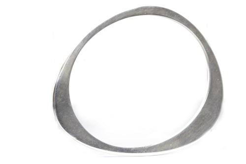 Lot 21 - GEORG JENSEN SILVER BANGLE of uneven oval form,...