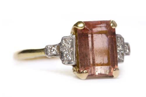 Lot 23 - PINK TOURMALINE AND DIAMOND SET RING in the...