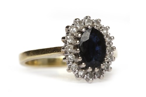 Lot 39 - SAPPHIRE AND DIAMOND CLUSTER RING the oval...