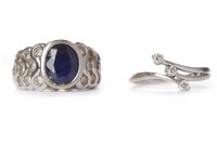 Lot 60 - SAPPHIRE AND DIAMOND RING the central oval cut...