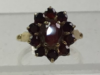 Lot 364 - GOLD AND GARNET DRESS RING