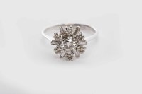 Lot 113 - DIAMOND CLUSTER RING the snowflake bezel with...