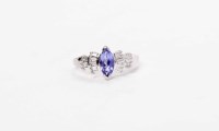 Lot 118 - TANZANITE AND DIAMOND RING set with a central...
