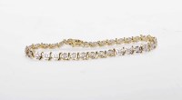 Lot 129 - DIAMOND BRACELET formed by round sections of...