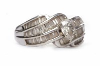 Lot 180 - DIAMOND DRESS RING the central six claw set...